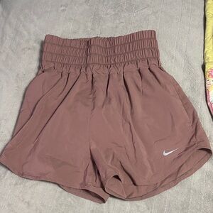 Nike Women's Athletic Shorts in mauve/brown color